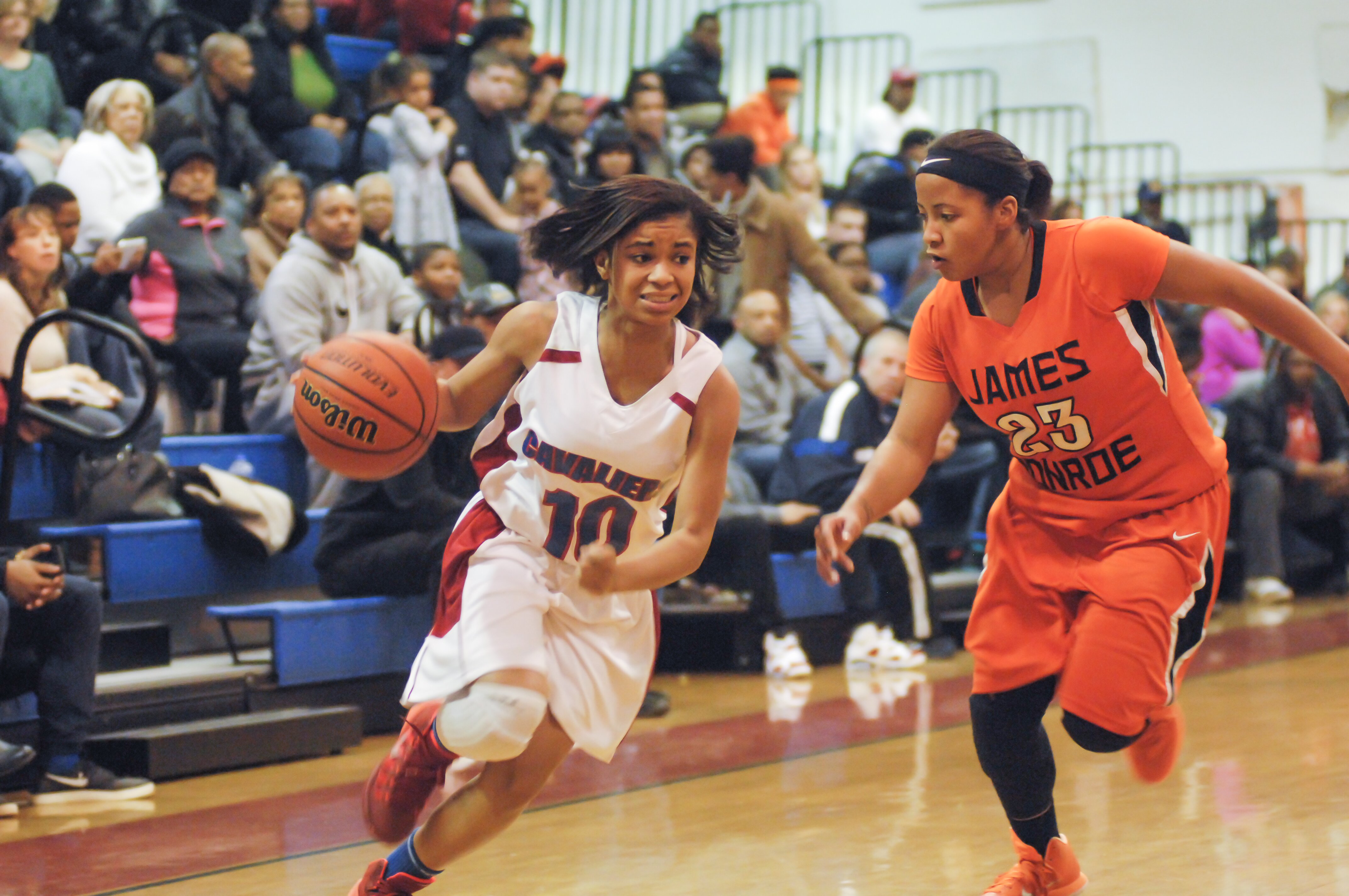 Makaila Smith drives the ball down the court.