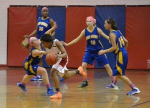 Jazmen Moore slips past a gauntlet of King George opponents. (Photo by Loren Kuske)