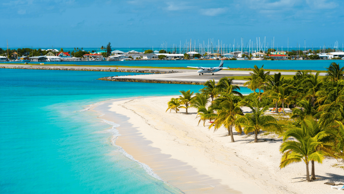 Tourist relaxing on beach hammcok in Eleuthera, Bahamas