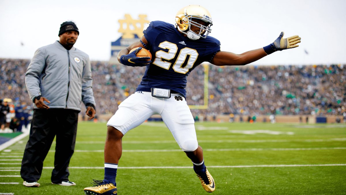 Notre Dame running back Jeremiyah Love (4) runs with the ball on his way to score a touchdown in the first half of a NCAA football game against Syracuse at Notre Dame Stadium on Saturday, Nov. 22, 2025, in South Bend.