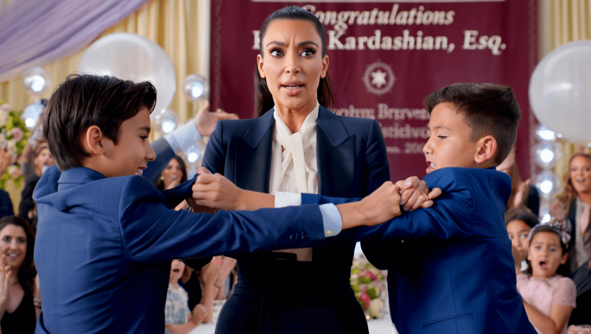 Kim Kardashian mortified as sons fight on stage during her law school graduation party