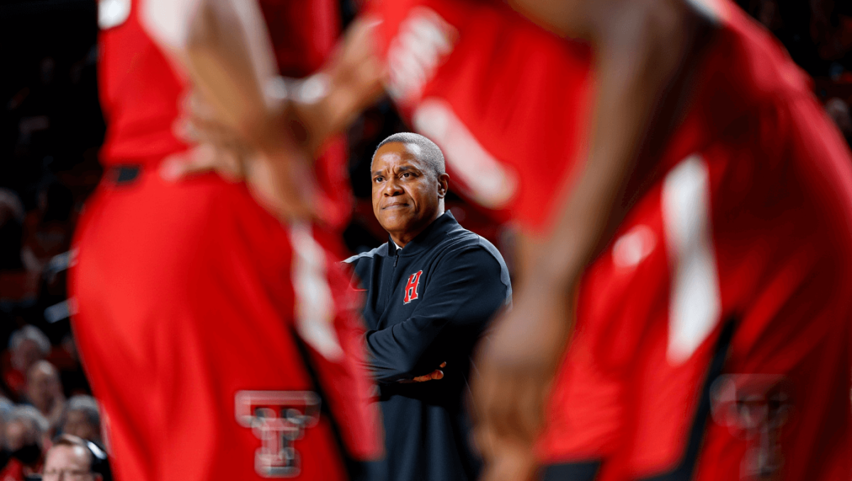  Texas Tech Red Raiders forward JT Toppin (15) works the ball against Houston Cougars forward Joseph Tugler (11) in the second half at United Supermarkets Arena.