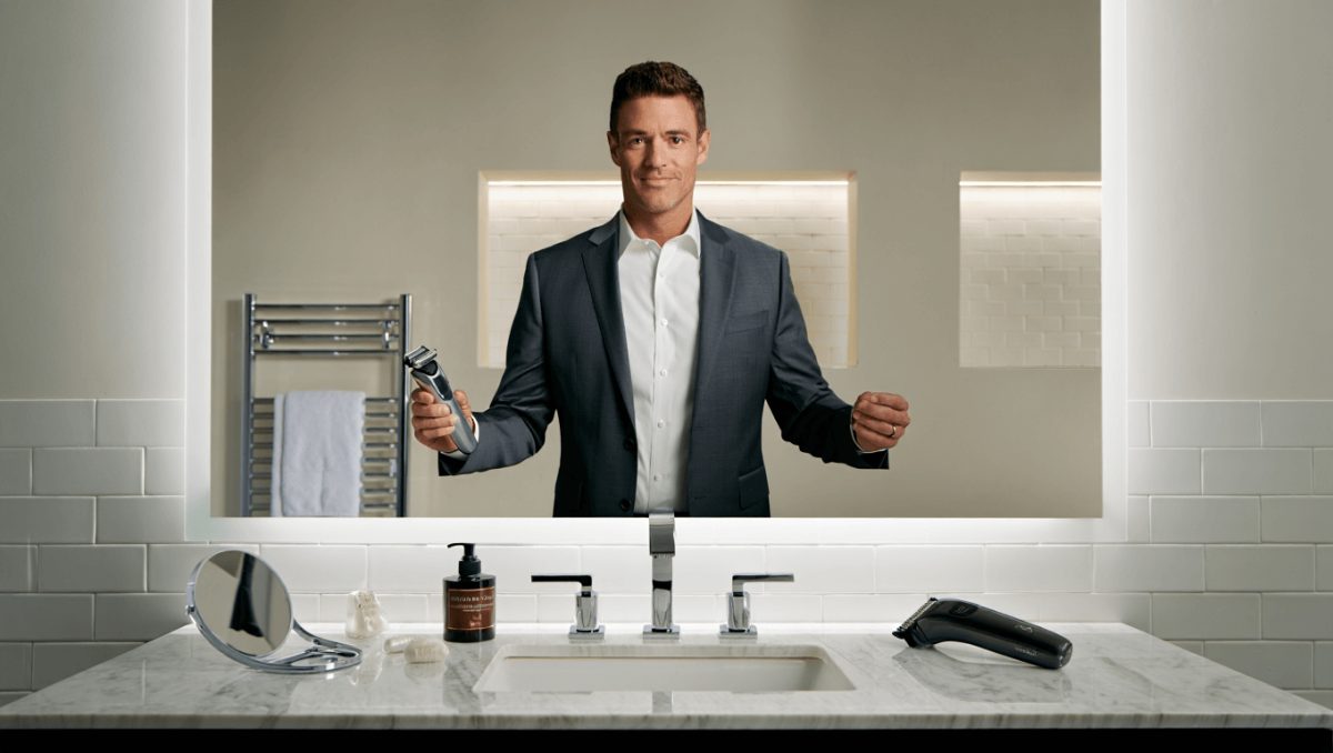In a still from Manscaped's Super Bowl ad, electric shaving tools sit on a counter next to anthropomorphized clumps of hair
