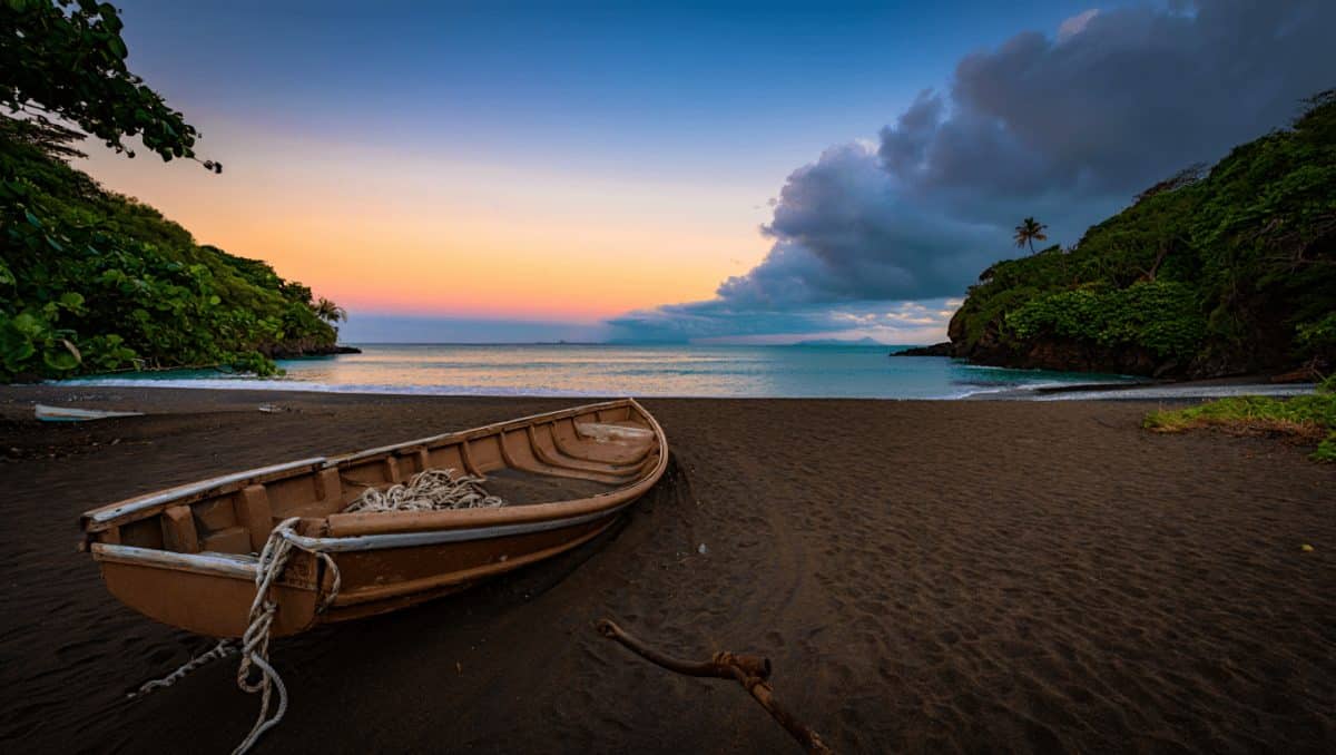 Woman walking along the beach in El Tunco, El Salvador