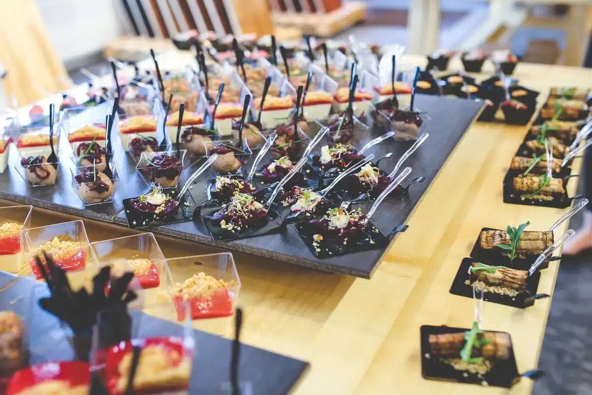 Influencers and celebrities sampling dishes at a modern café, evaluating menu items.