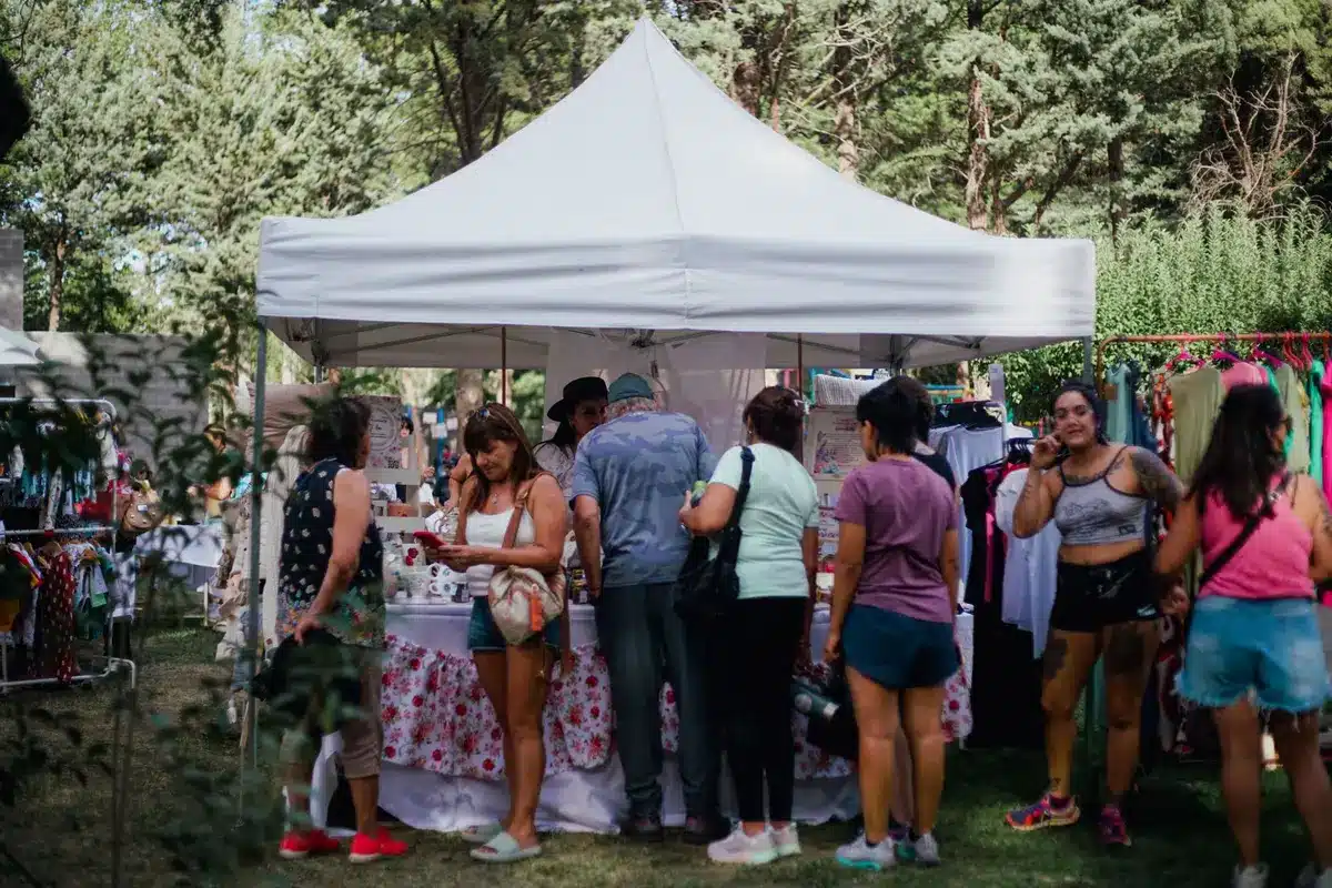 Festival vendors and local businesses setting up tents and booths at an outdoor event