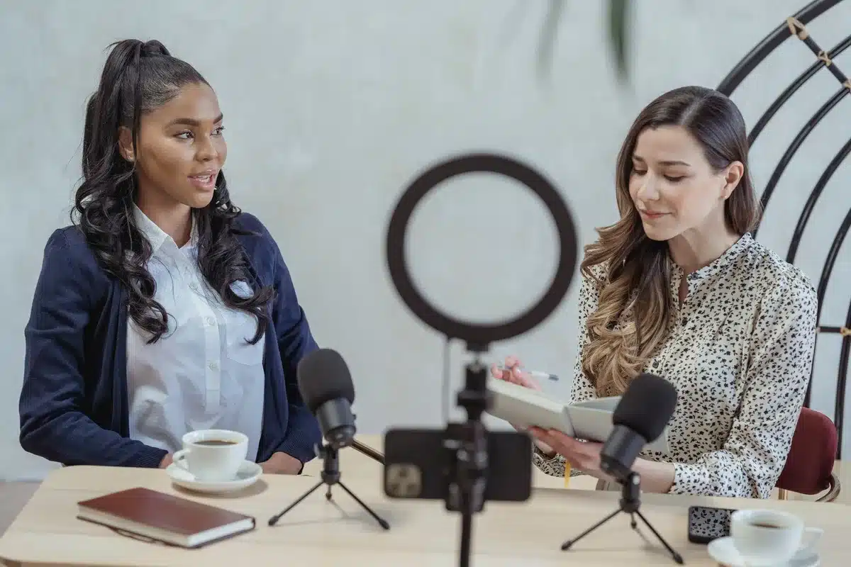 Person recording a video message in a studio setting