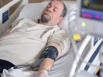 Hospital room with medical equipment and monitors, representing end-of-life care