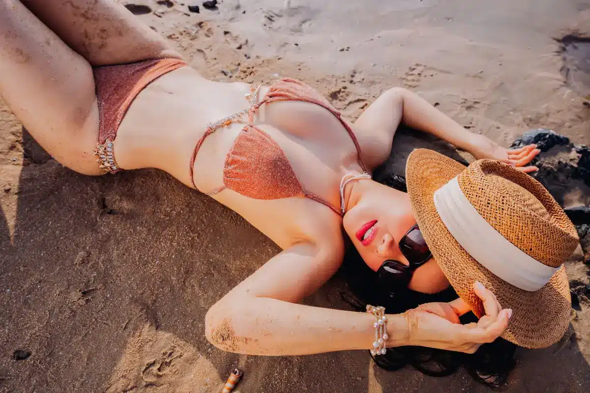Leopard-print Gucci bikini and matching miniskirt with designer sunglasses and sandals