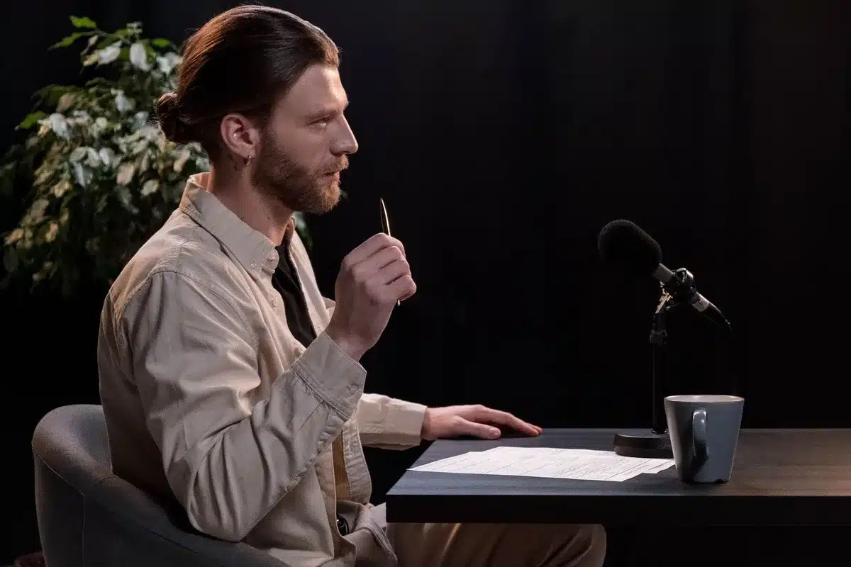 Late-night talk show stage with host and guest seated during an interview