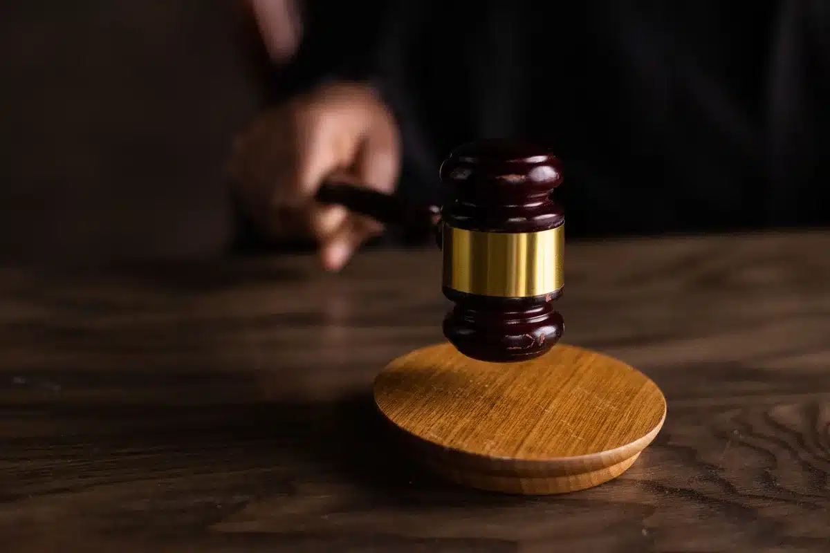 Courtroom setting with gavel symbolizing legal proceedings and charges