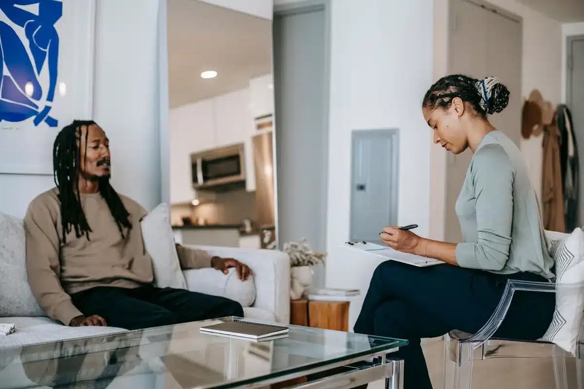 Person in a counseling or therapy session representing recovery and support