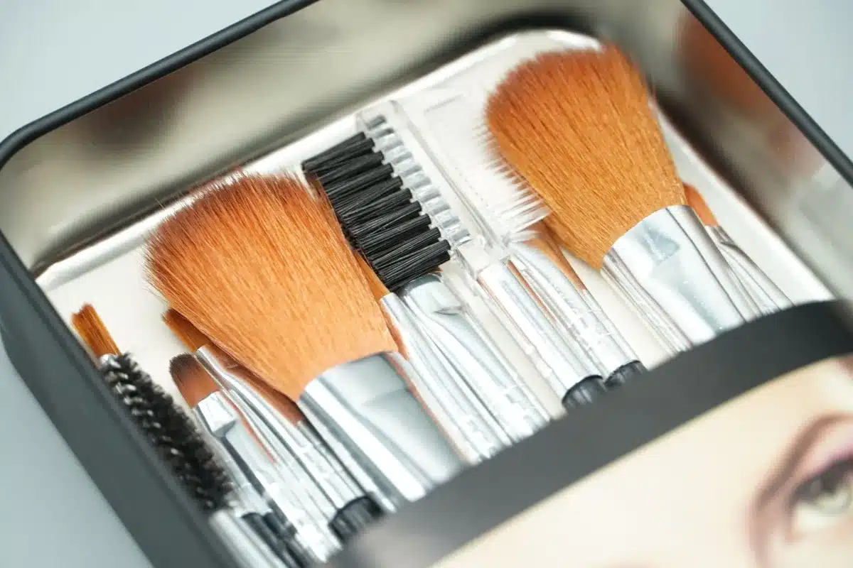 An open beauty subscription box displaying colorful cosmetic samples and product testers