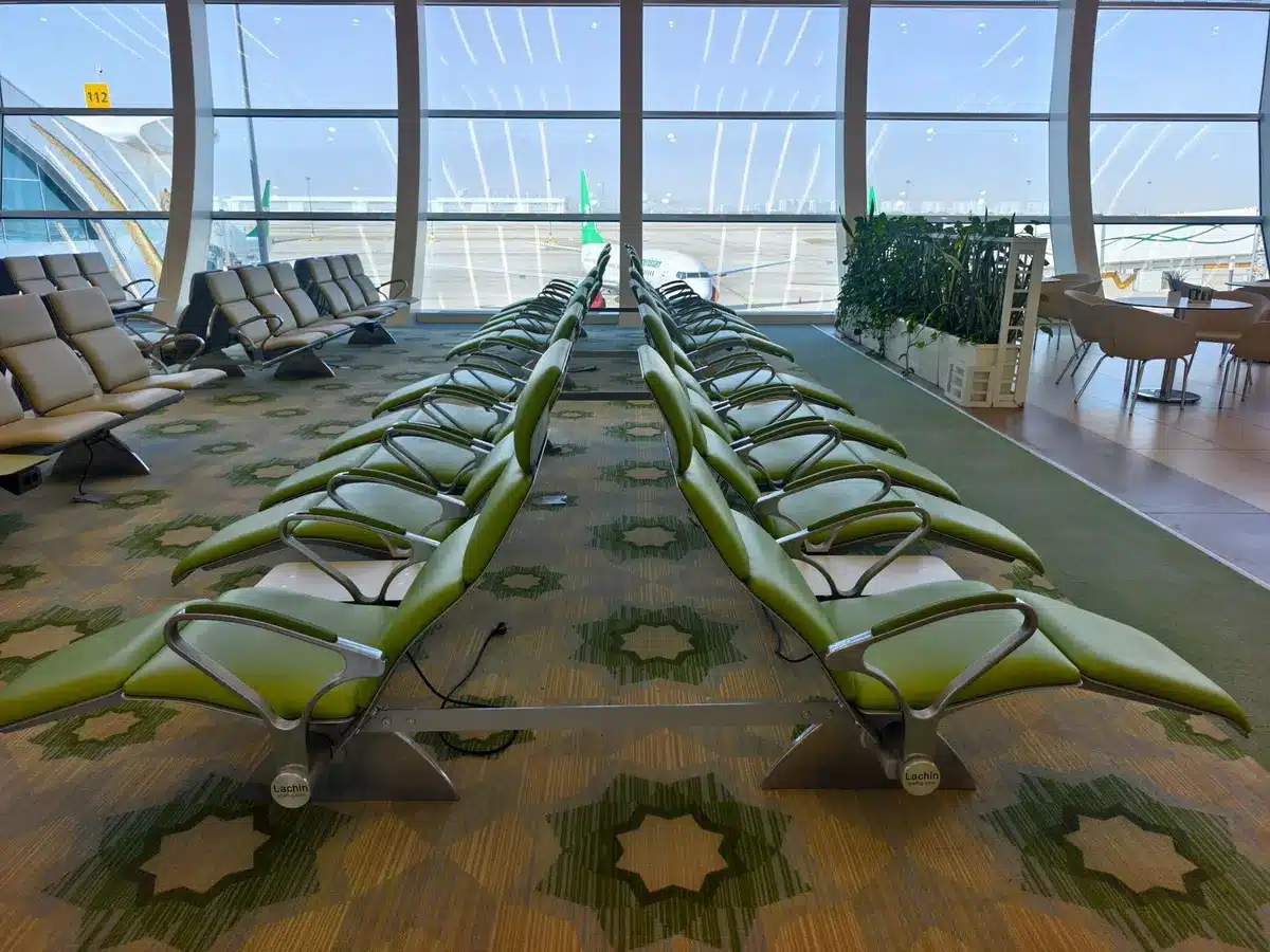 Comfortable seating and work area in modern airport lounge