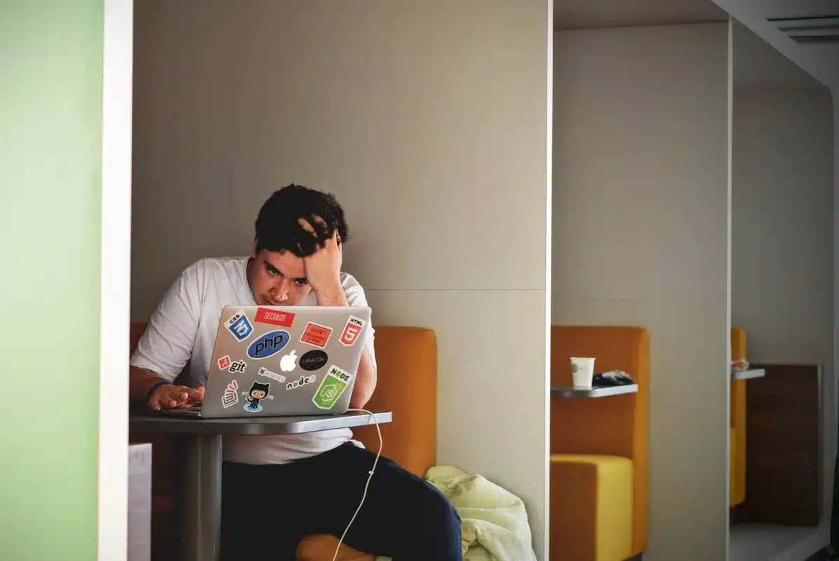 Person showing signs of stress and anxiety while using a smartphone