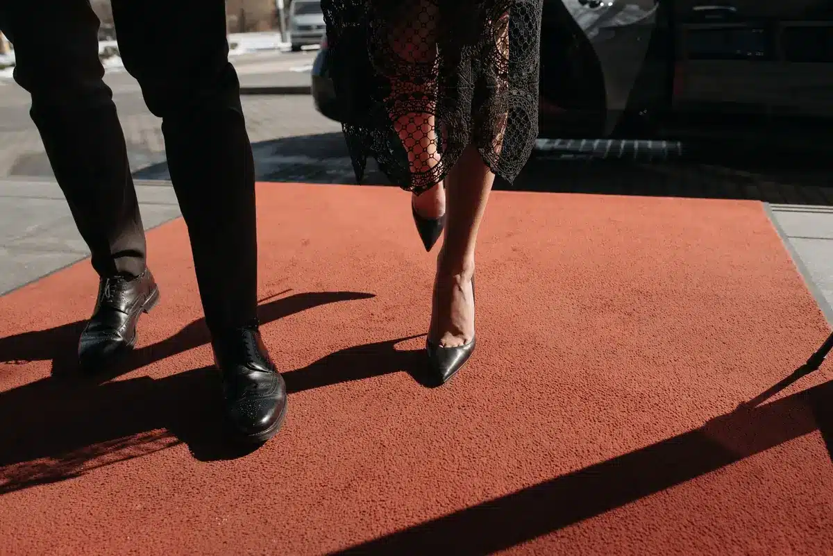Elegantly dressed guests arriving at a premium event venue