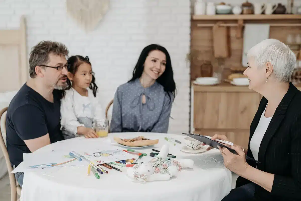 Two adults in conversation about family matters in a home setting