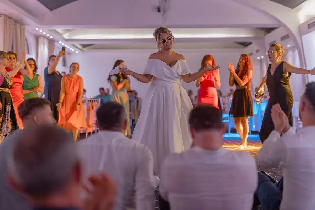 Elegant wedding reception with guests celebrating in formal attire
