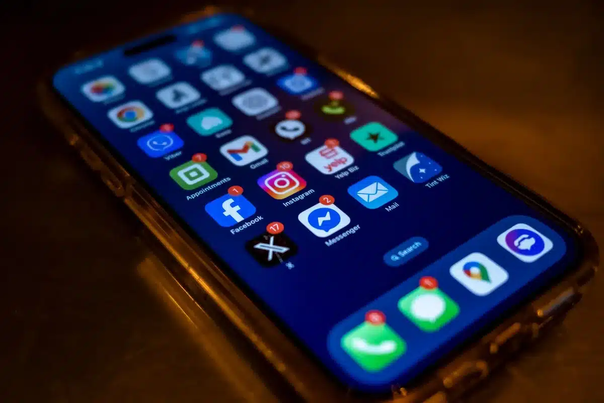 Smartphone displaying social media notifications and posts during a heated online debate