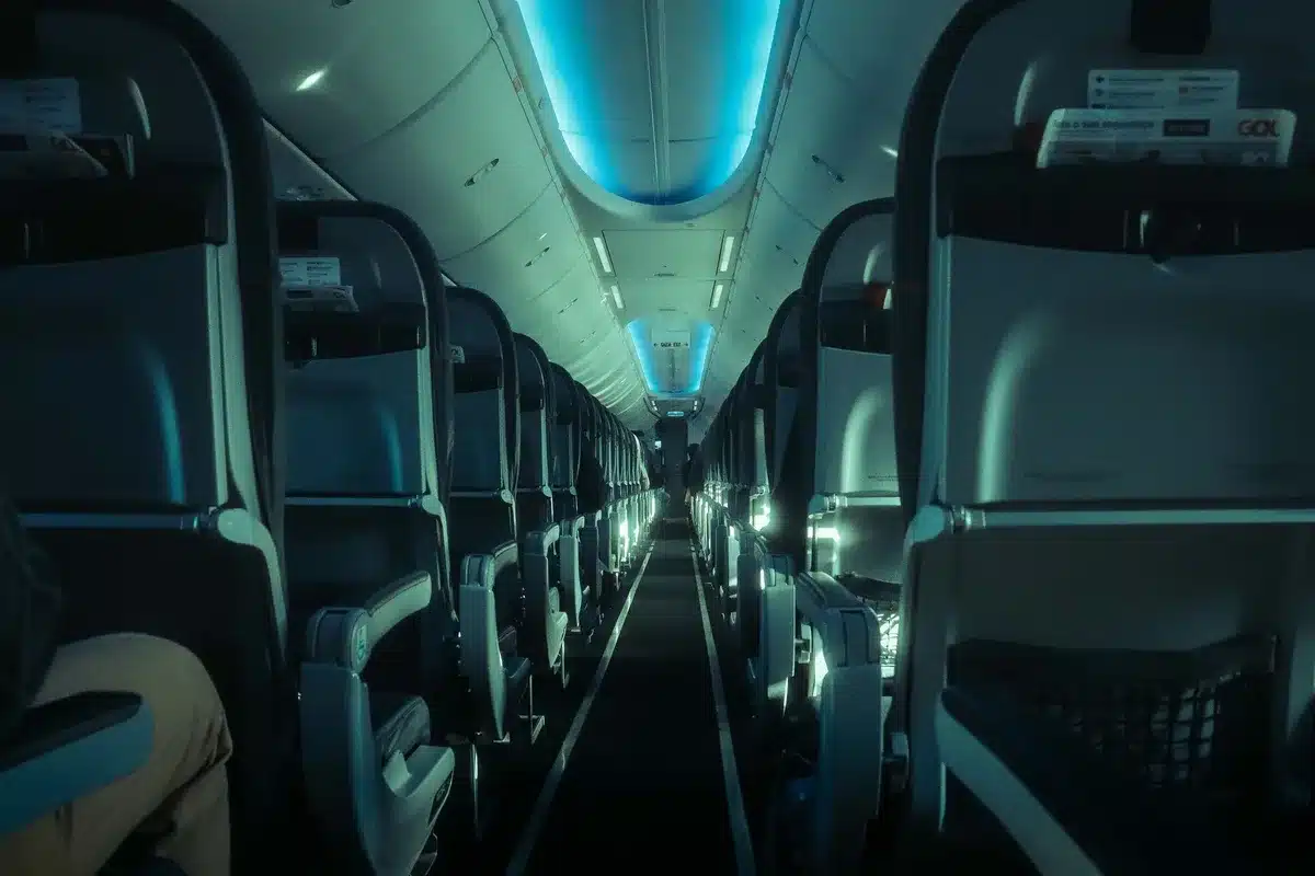 Modern aircraft cabin interior with premium seating, soft lighting, and contemporary design elements