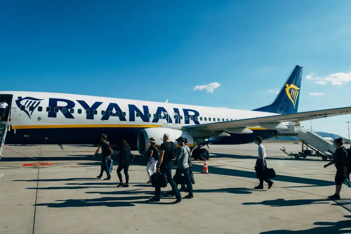 Travelers boarding a modern aircraft for summer adventure travel