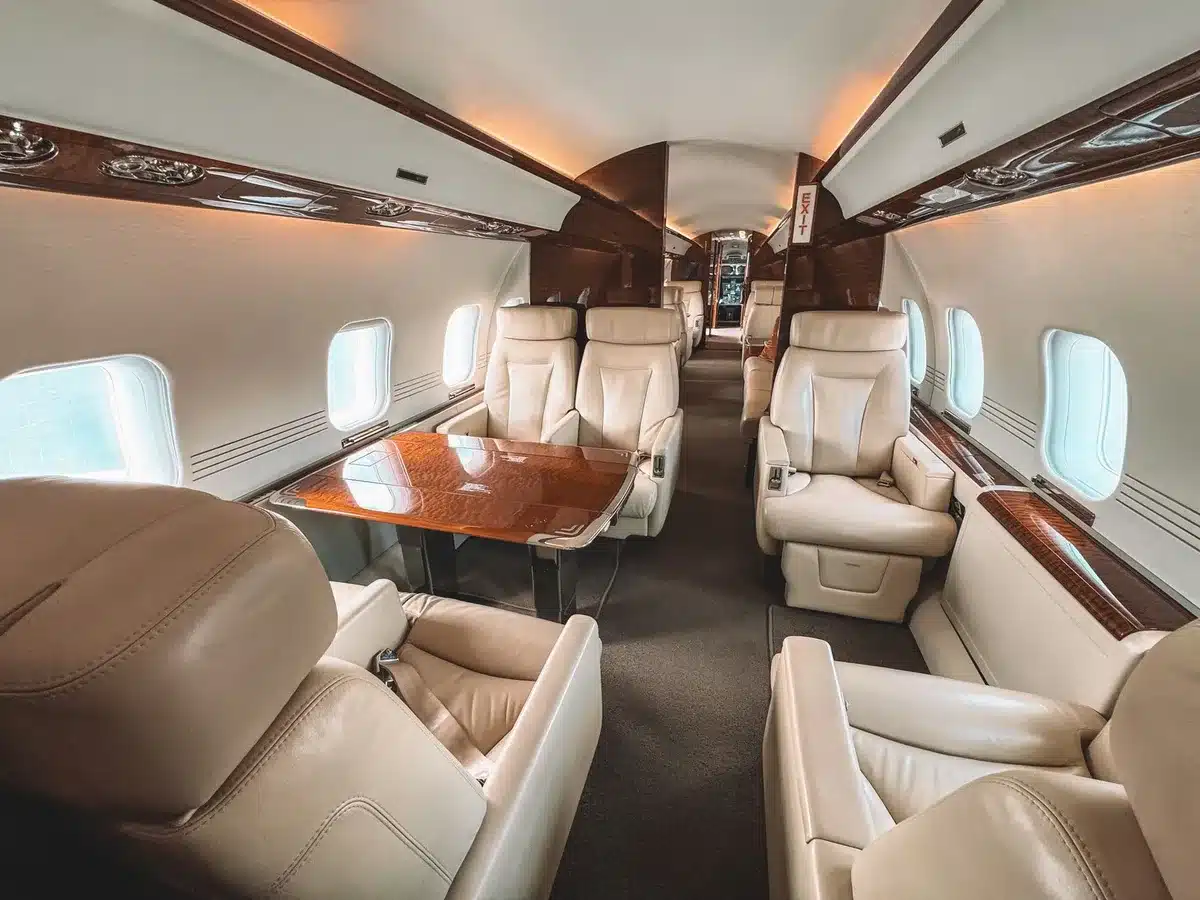 Modern aircraft cabin with premium seating and improved lighting on a long-haul flight.