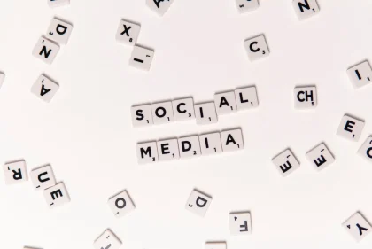 Hands using smartphone to scroll through social media posts and notifications on screen