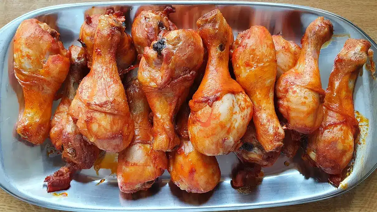 Roadside stall serving jerk chicken and roti to customers