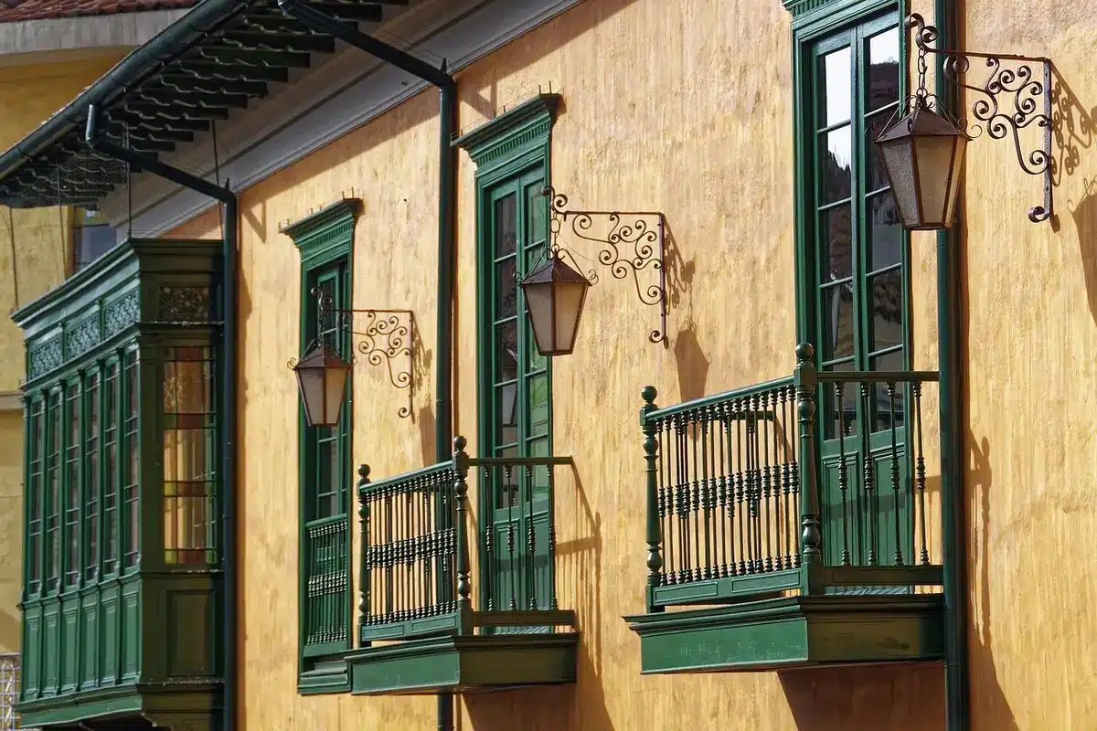 Weathered wooden facades and French-colonial buildings along a harbour street