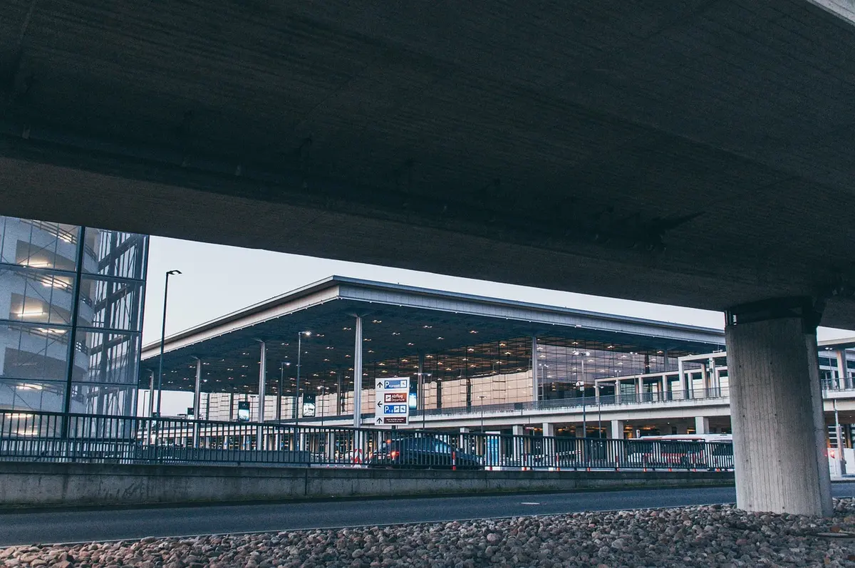 Terminal with passengers and gate area showing operational impacts