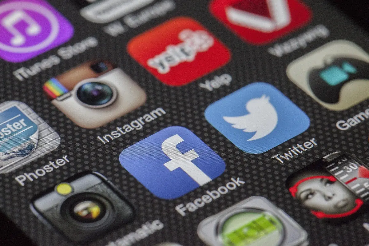 Smartphone screen displaying social media posts and comments, illustrating online misinformation