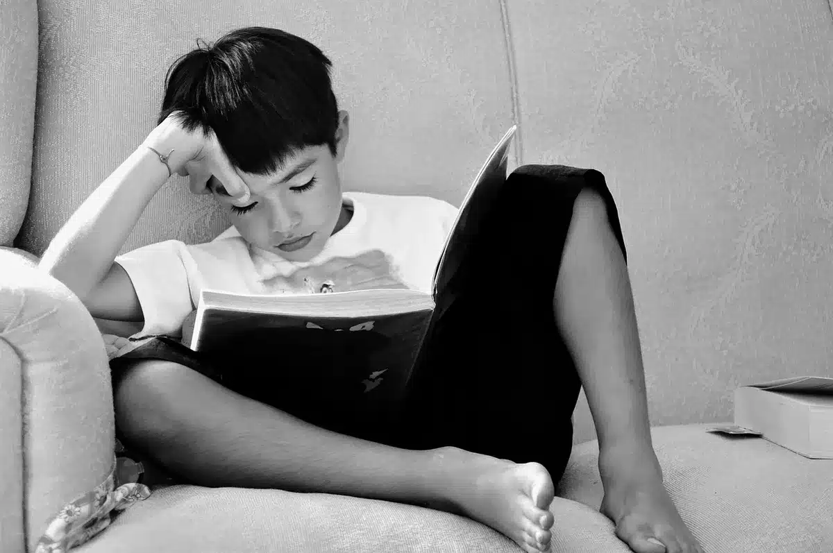 Children reading books together, representing the impact of literacy and education programs