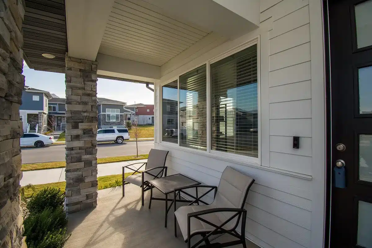 Couple relaxing on a porch in a coastal home
