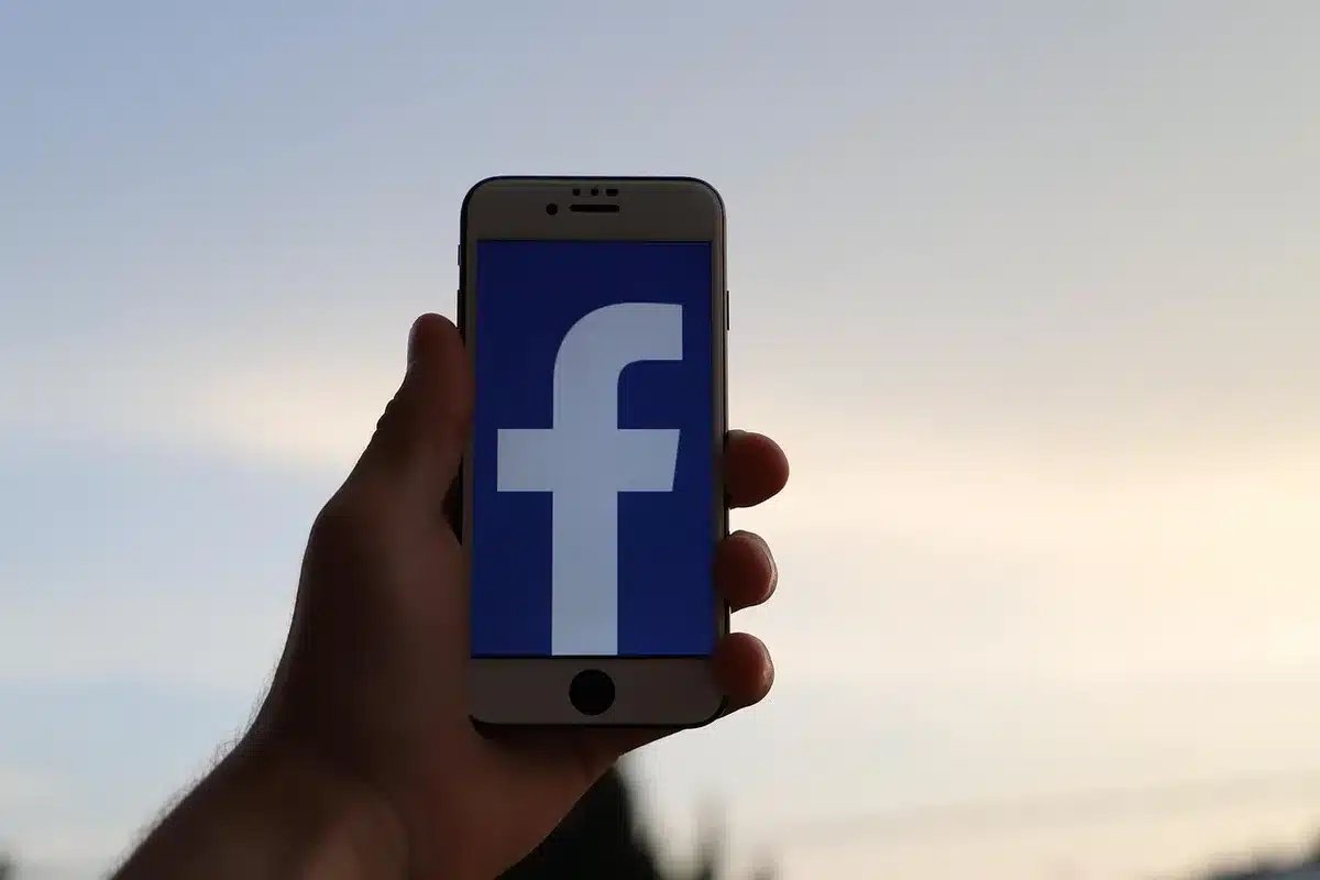 Smartphone showing social media notifications and a tribute post