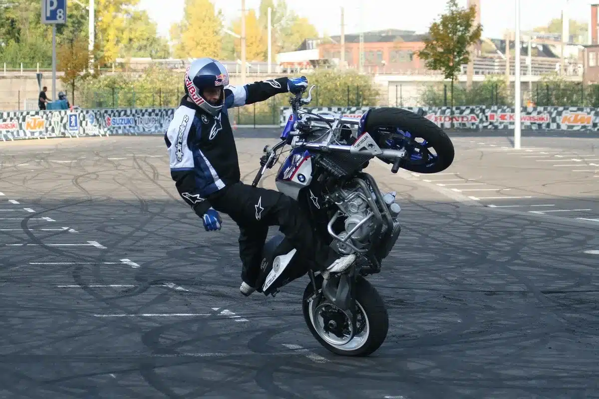 Actor rehearsing a physical stunt under supervision on set
