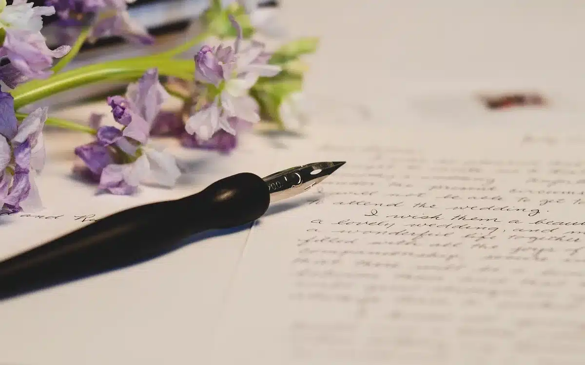 Conservator examining handwriting under magnification in a lab
