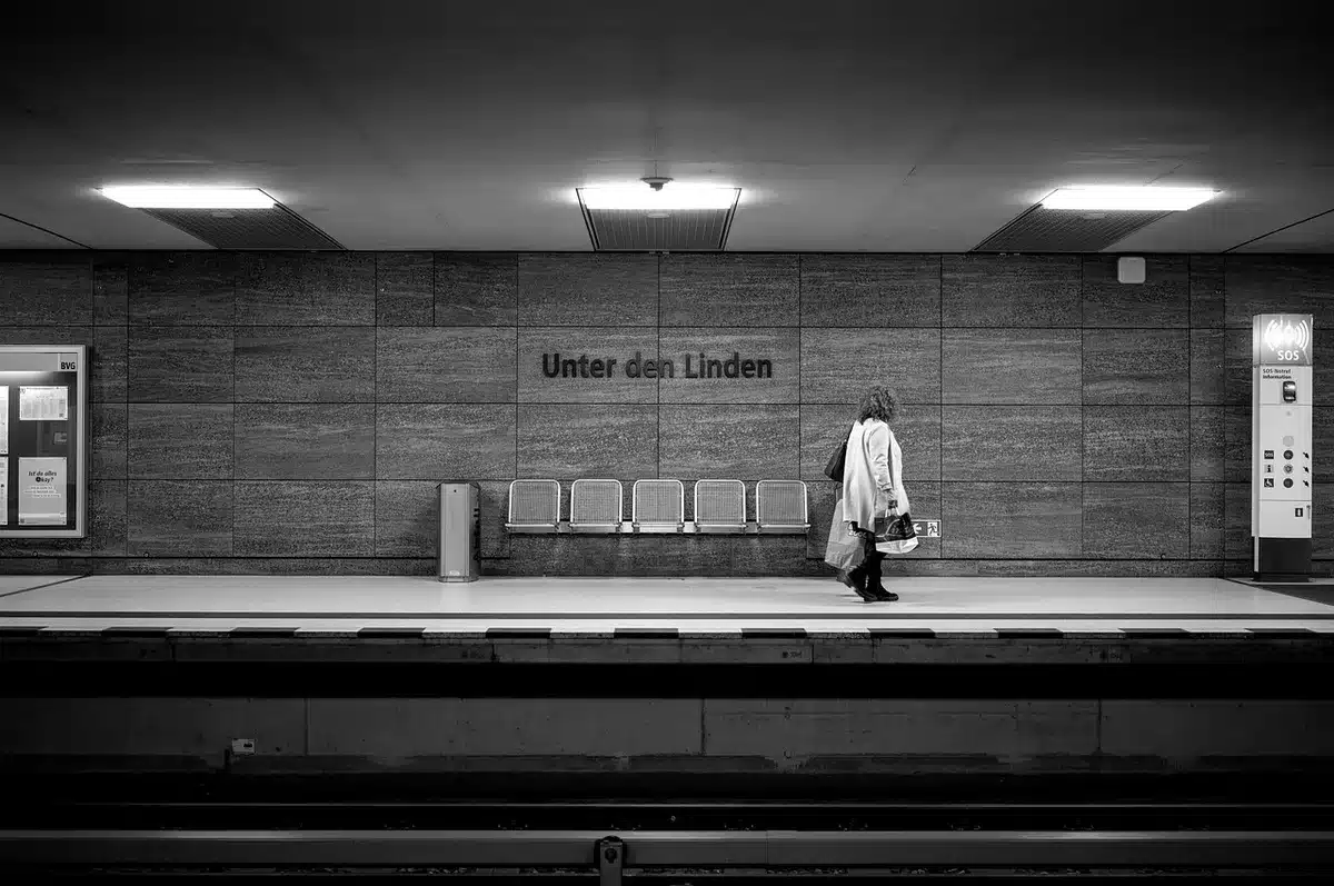 Commuters entering a busy underground station, illustrating daily transit rhythms