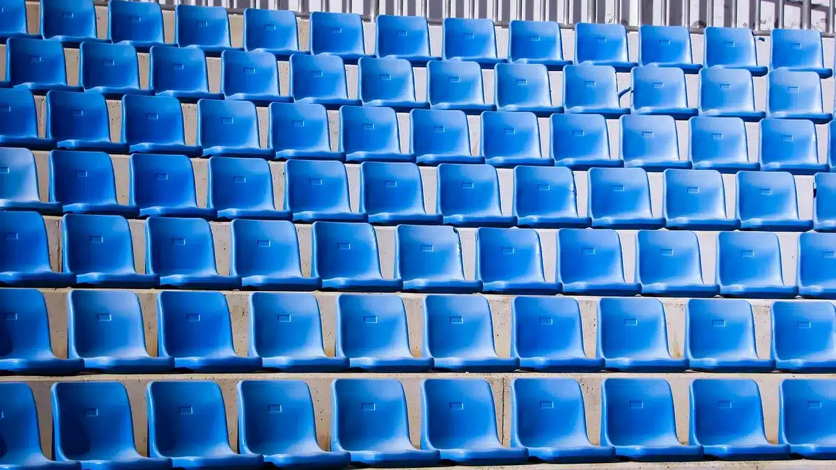 Empty theater seats and a playbill on a seat