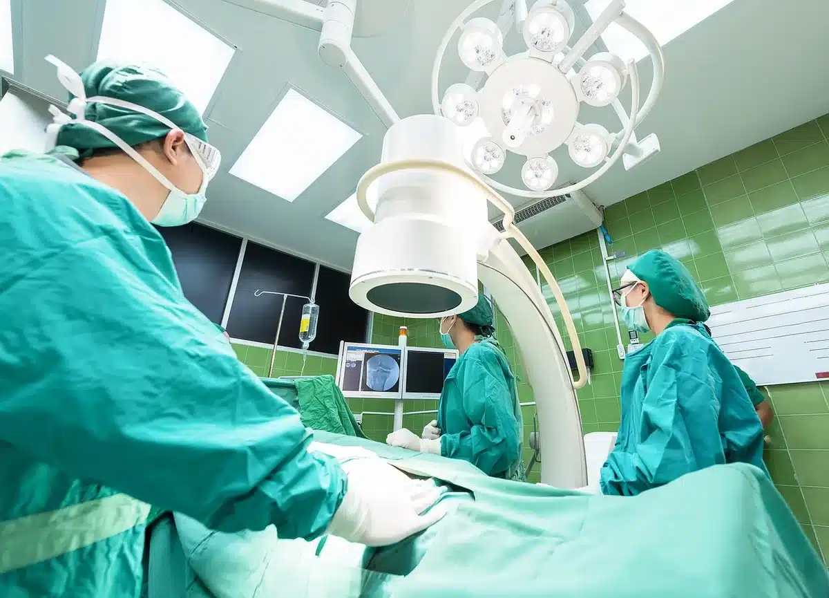 Medical professionals performing emergency bypass surgery in an operating room