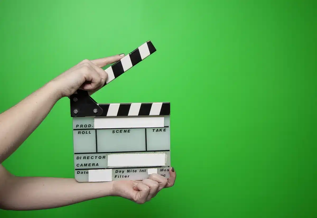 Anonymous film crew around a production meeting table on set