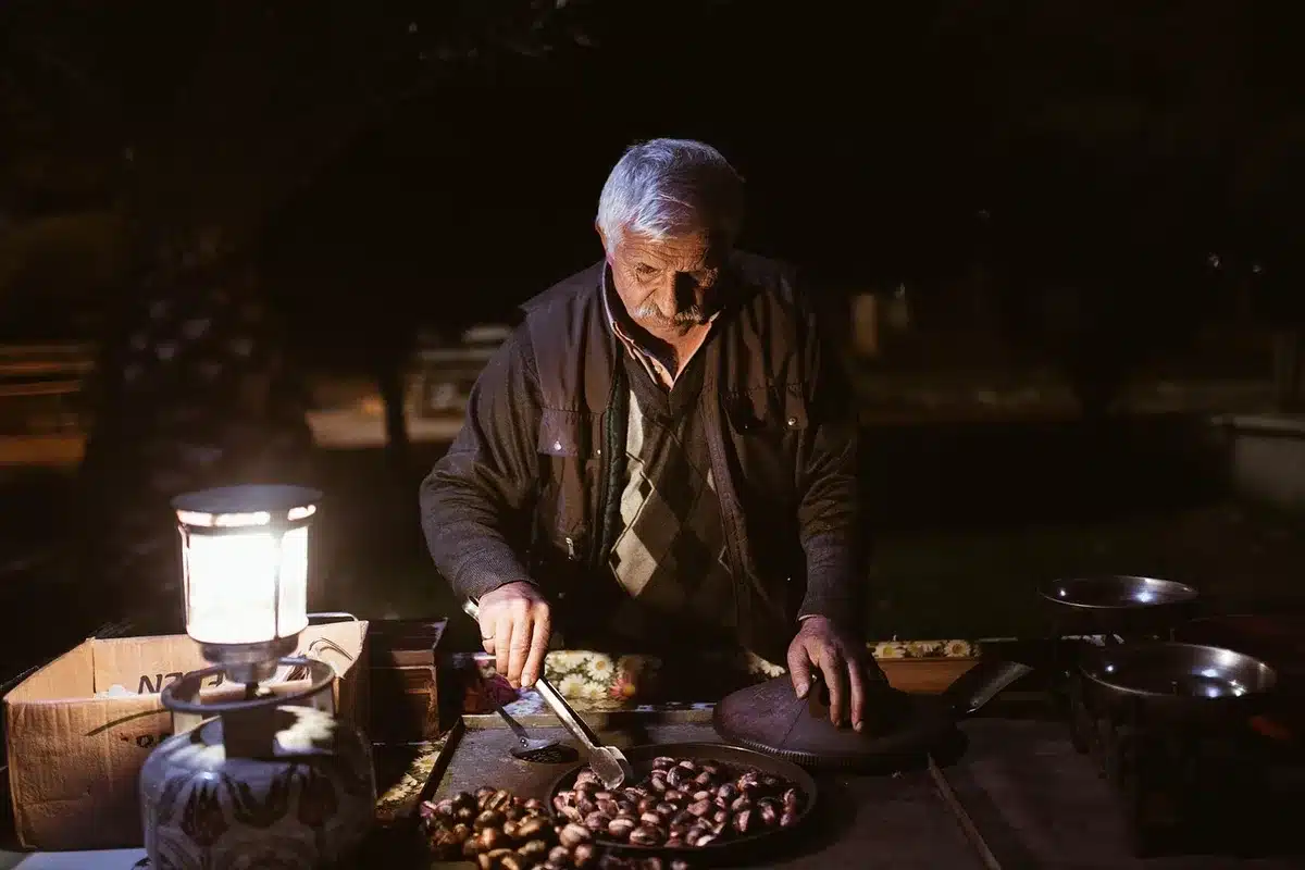 Traveler checking food prices at a Budapest street vendor