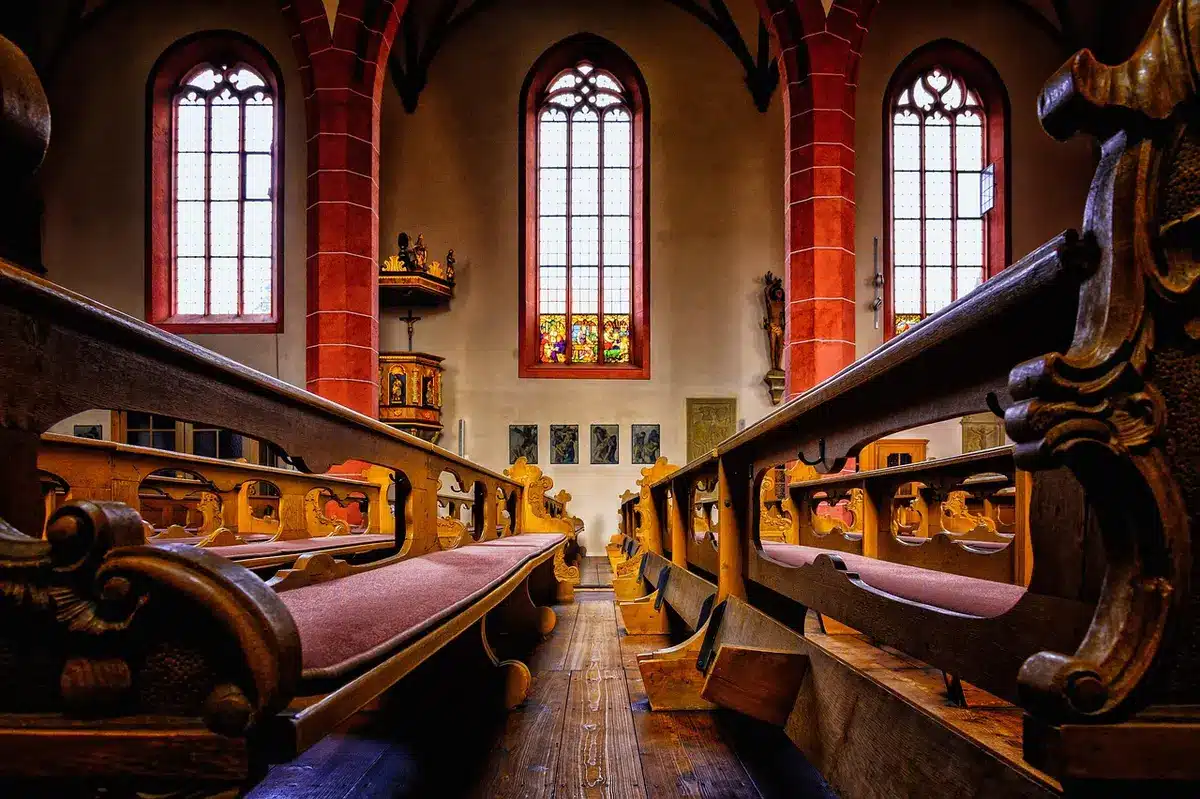 Man in a church pew and therapy journal illustrating rebuilding