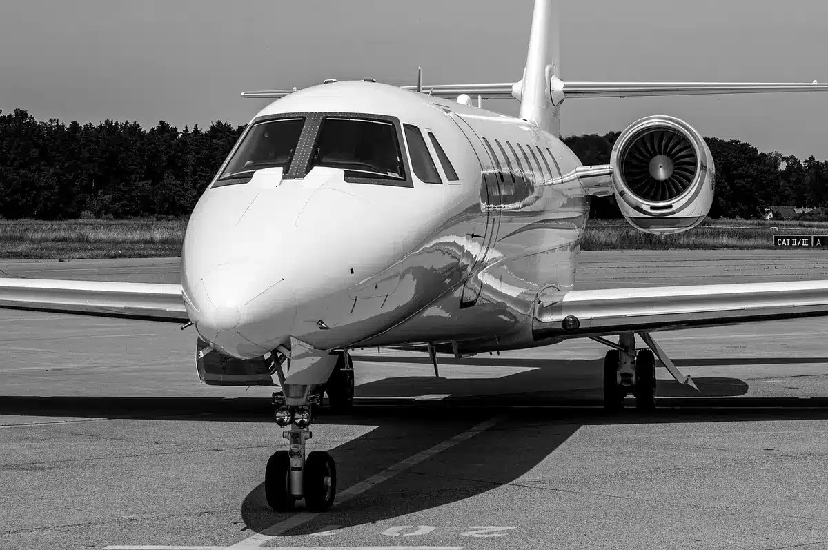 Parked aircraft at a regional airport gate with few ground staff