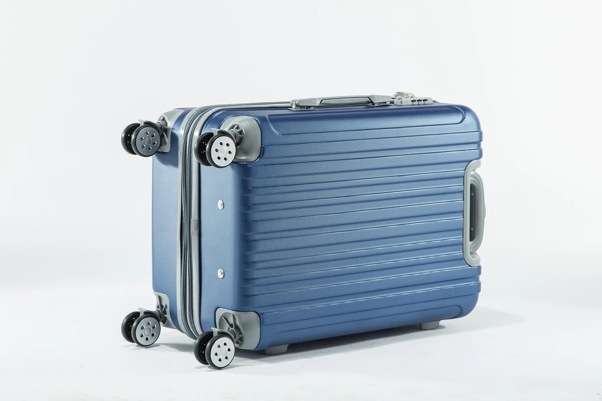 Carry-on bag and boarding pass on a table illustrating baggage limits
