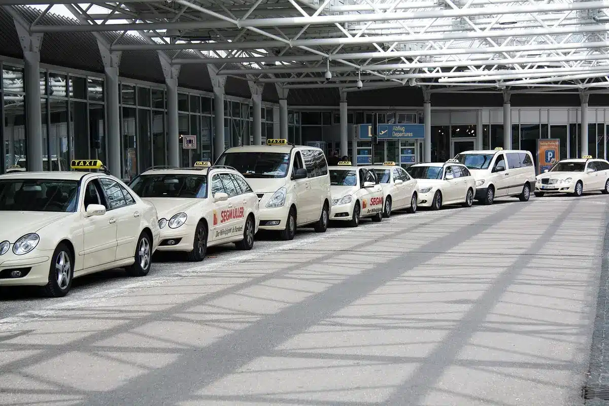 Crowded airport terminal concourse with passengers near gates