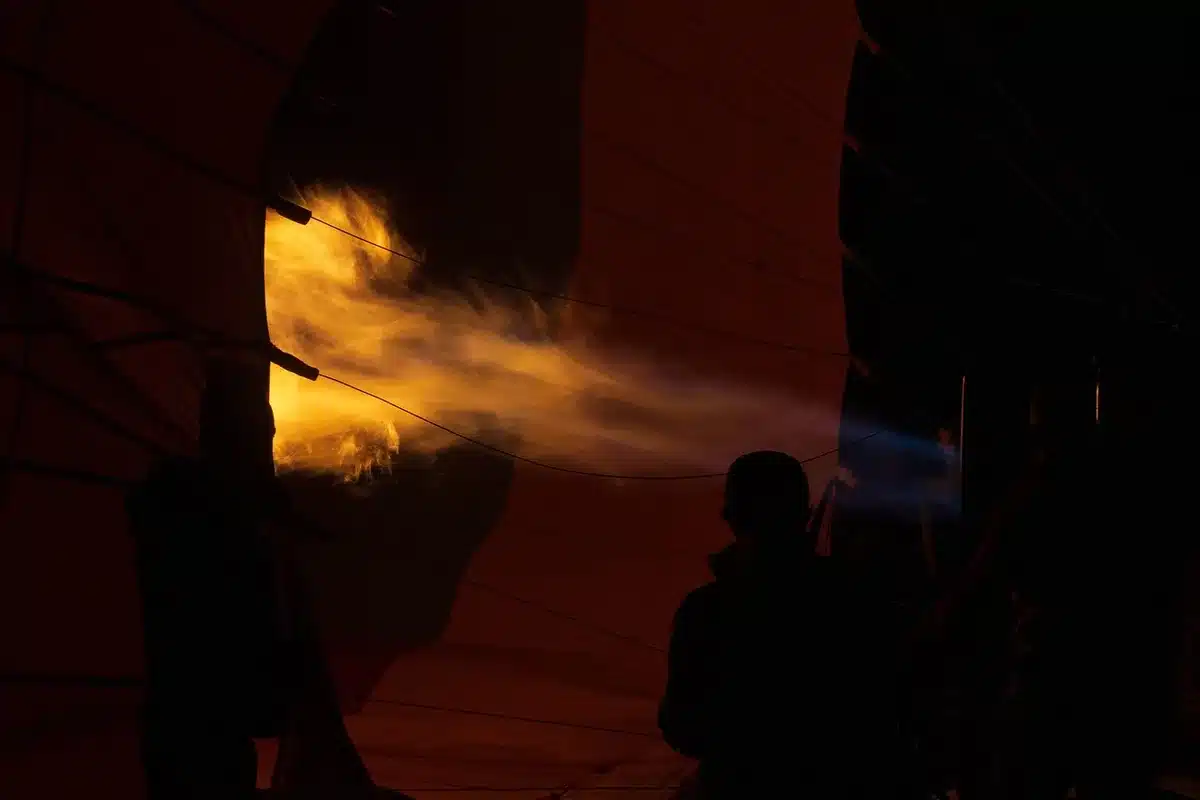 Glowing Darvaza gas crater flames in the Karakum Desert at dusk