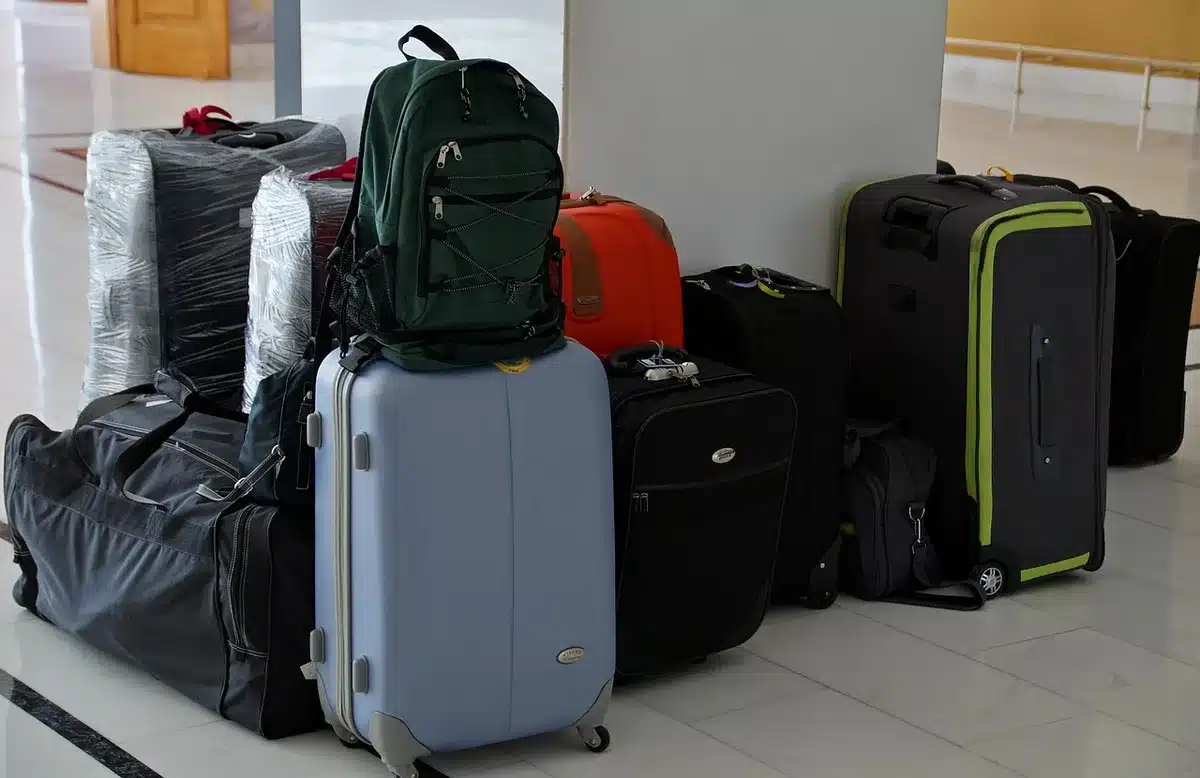 Silhouette of a person leaving a studio with a suitcase, symbolizing an actor's exit