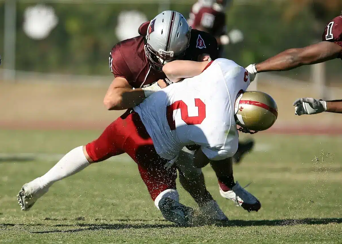 Defensive front pushing through the line to pressure the quarterback