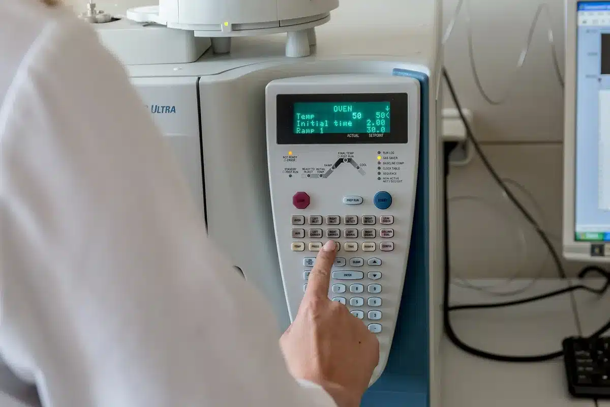 Laboratory vials and testing equipment representing PFAS research