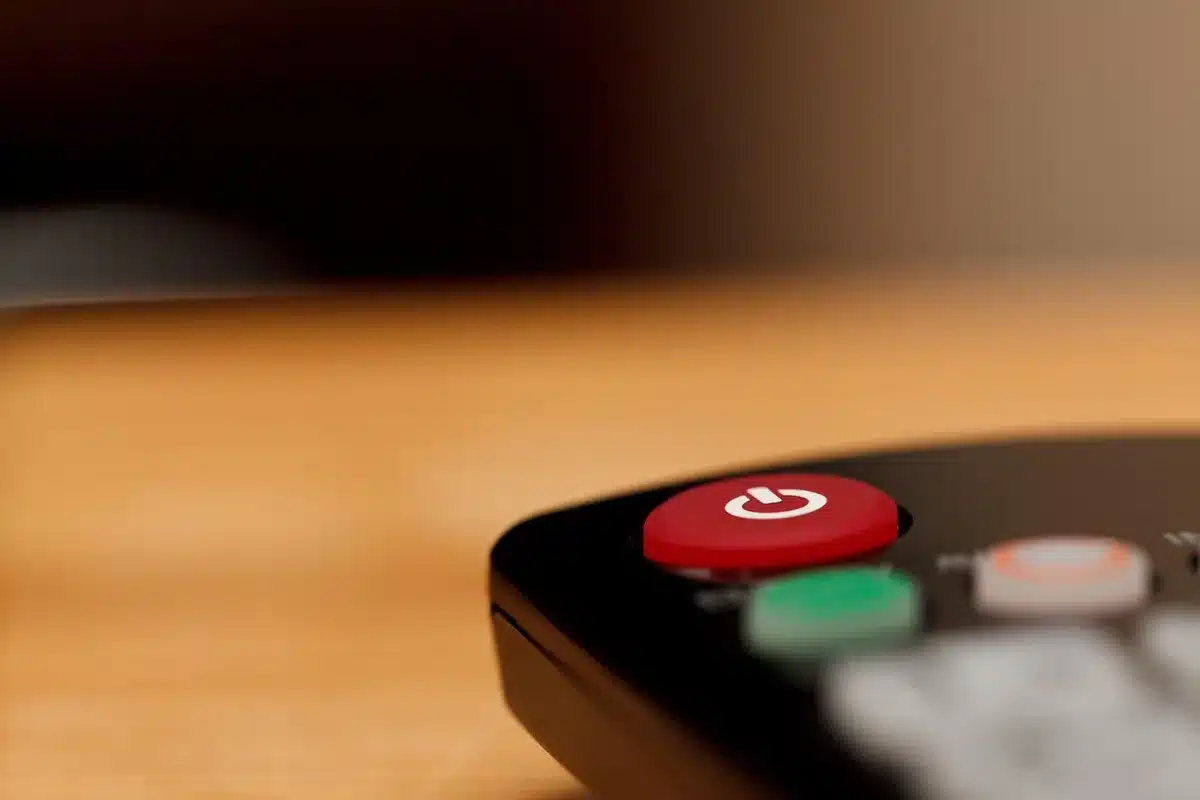 TV guide and remote showing football game times